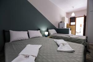 Postel nebo postele na pokoji v ubytování AK VILLAGE ROOMS