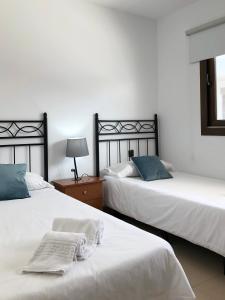 Кровать или кровати в номере Cotillo Ocean View