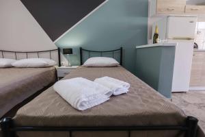 Postel nebo postele na pokoji v ubytování AK VILLAGE ROOMS