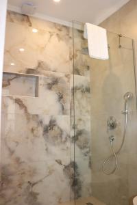 a bathroom with a shower with a glass at Zest Exclusive Hotel & Spa in Ortakent