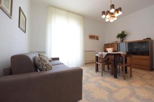 a living room with a couch and a table at Casa Vacanze TITINA HOME in Montalbano