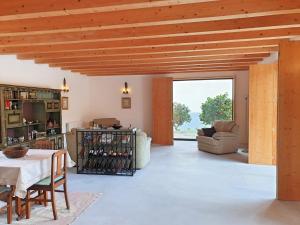 a large living room with a table and chairs at Casa das Hortênsias in Alijó