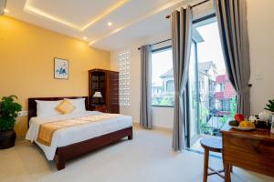 Giường trong phòng chung tại Aba Travel Villa