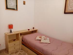 Ένα ή περισσότερα κρεβάτια σε δωμάτιο στο Casa Vicolo Urbano