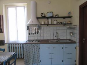 Kuchyň nebo kuchyňský kout v ubytování Un letto nel cortile