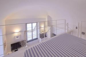 A bed or beds in a room at Blu mare
