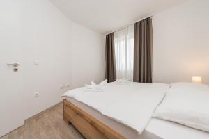 Postel nebo postele na pokoji v ubytování VILLA PETAR'S DREAM 3