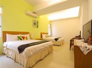 מיטה או מיטות בחדר ב-Summertimeph Homestay