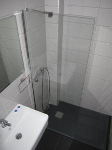 a bathroom with a shower and a sink at Tina Hotel in Dassia