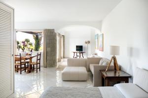 a living room with a couch and a table at Luxury Relais Villa Magdalena in Ischia