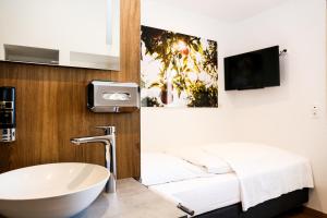 TV a/nebo společenská místnost v ubytování Landhotel Grashof