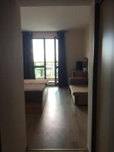 a room with two beds and a large window at Къща за гости Емона,Обзор in Obzor