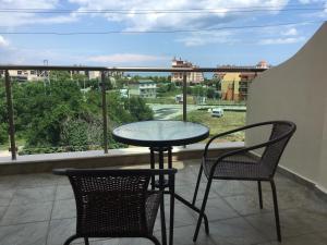 a table and chairs on a balcony with a view at Къща за гости Емона,Обзор in Obzor