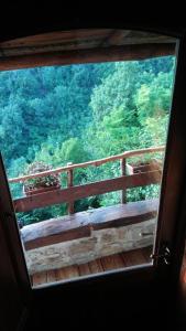 a view from a window of a wooden balcony at B&B Da Marta in Apricale