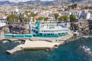 an aerial view of a building on the water at Apartment - The Historical Center of Funchal in Alojamento Local in Funchal
