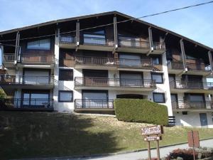 an apartment building with balconies on the side of it at Chalet de Basseville in Combloux