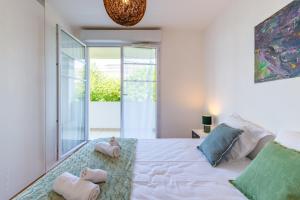 a bedroom with a bed with two stuffed animals on it at Cozy Corner in Montévrain