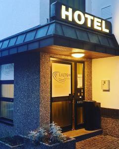 a hotel with a sign on the front of it at LILTON Hotel Stuttgart-Zuffenhausen in Stuttgart