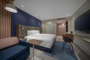 Postel nebo postele na pokoji v ubytování Holiday Inn Express Shanghai Jinqiao Central by IHG + 37 fotografií