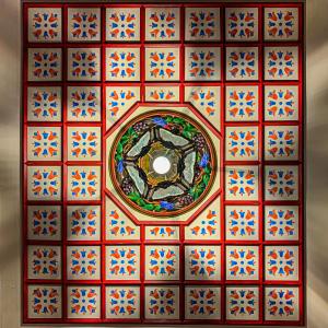 a colorful tile ceiling with a circle in the middle at ARCHONTARIKI Historic Boutique Hotel in Ioannina