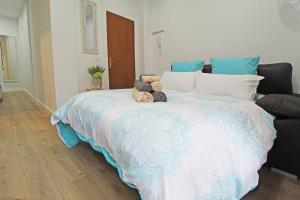 En eller flere senge i et værelse på Apartamento muy céntrico 5 minutos playa (2º)