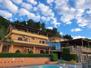 a building with a pool in front of it at Paradiso Country House in Pescara