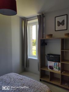 Postel nebo postele na pokoji v ubytování Au 157 - Locations Contrexéville