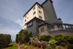 a black and white building on a hill at Shearwater Inn in Lincoln City