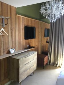 TV a/nebo společenská místnost v ubytování Room with a vue