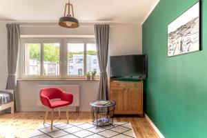 TV a/nebo společenská místnost v ubytování SeaFolks Apartments