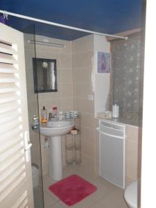 a bathroom with a sink and a shower at Mas de La Boheme - L'Hermet in Saint-Léons