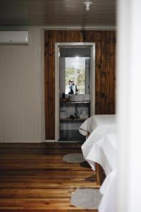 Cama ou camas em um quarto em Pousada Recanto do Lago