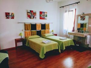 Postel nebo postele na pokoji v ubytování Casa Favaretto Guest House