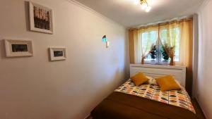 Posteľ alebo postele v izbe v ubytovaní Apartament Motylek