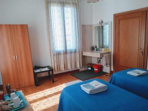 Postel nebo postele na pokoji v ubytování Casa Favaretto Guest House