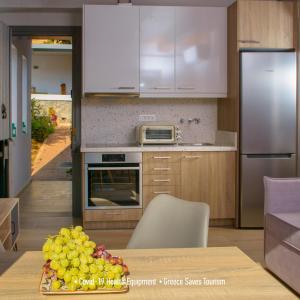 A kitchen or kitchenette at Villa Douloumi