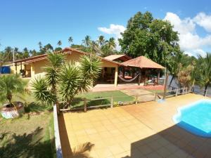 Photo de la galerie de l'établissement CASA AMARELA Beira Rio Guriri, à Guriri