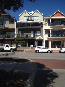 a white van parked in front of a white house at Breakwater Short Stay in Mandurah
