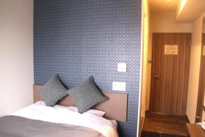 Postel nebo postele na pokoji v ubytování Hotel Sun Royal Utsunomiya