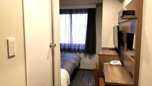 Postel nebo postele na pokoji v ubytování Hotel Sun Royal Utsunomiya