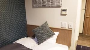 Postel nebo postele na pokoji v ubytování Hotel Sun Royal Utsunomiya