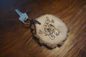 a key chain with a drawing on it on a table at Masia Can Constans in Queralbs