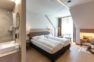 Łóżko lub łóżka w pokoju w obiekcie Hotel Nationalpark