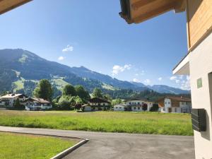 a view of a village with mountains in the background at Apartment Steixner in Westendorf
