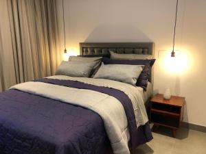 Ένα ή περισσότερα κρεβάτια σε δωμάτιο στο Loft em Moema, próximo ao Metro, com estacionamento no condomínio +45 φωτογραφίες