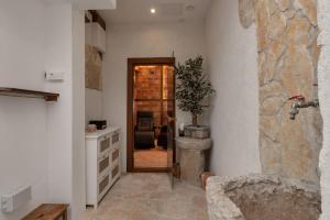 a hallway with a kitchen with a door to a room at Villa Sukara in Makarska