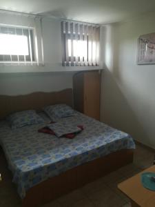 Postel nebo postele na pokoji v ubytování Pensiunea Lyo