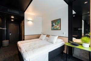 Postel nebo postele na pokoji v ubytování Art Hotel Pallas by Tartuhotels