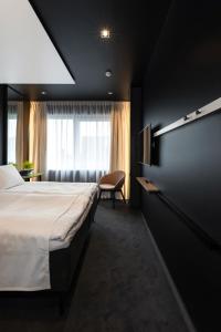 Postel nebo postele na pokoji v ubytování Art Hotel Pallas by Tartuhotels