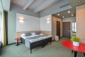 Postel nebo postele na pokoji v ubytování Art Hotel Pallas by Tartuhotels